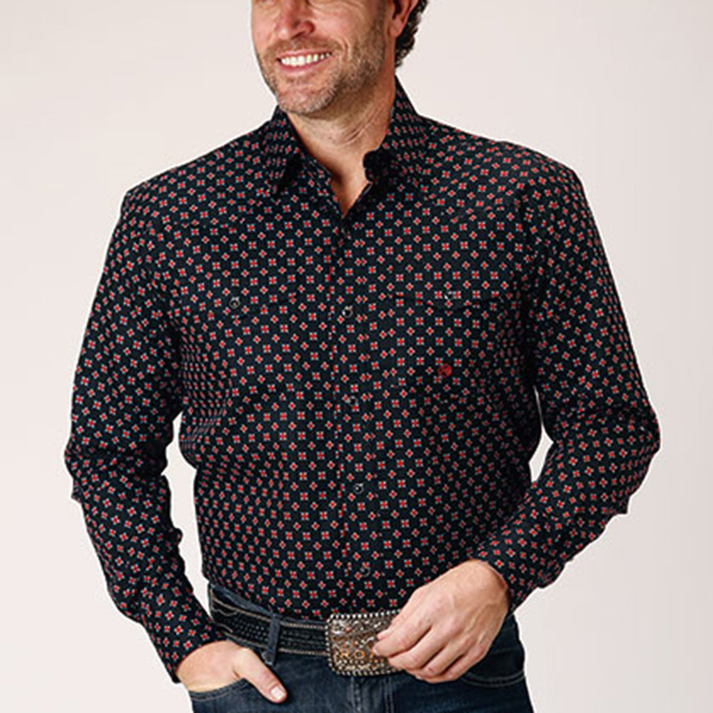Black pearl snap shirt with small red roses, black snaps, two front pockets, and two western yokes. 