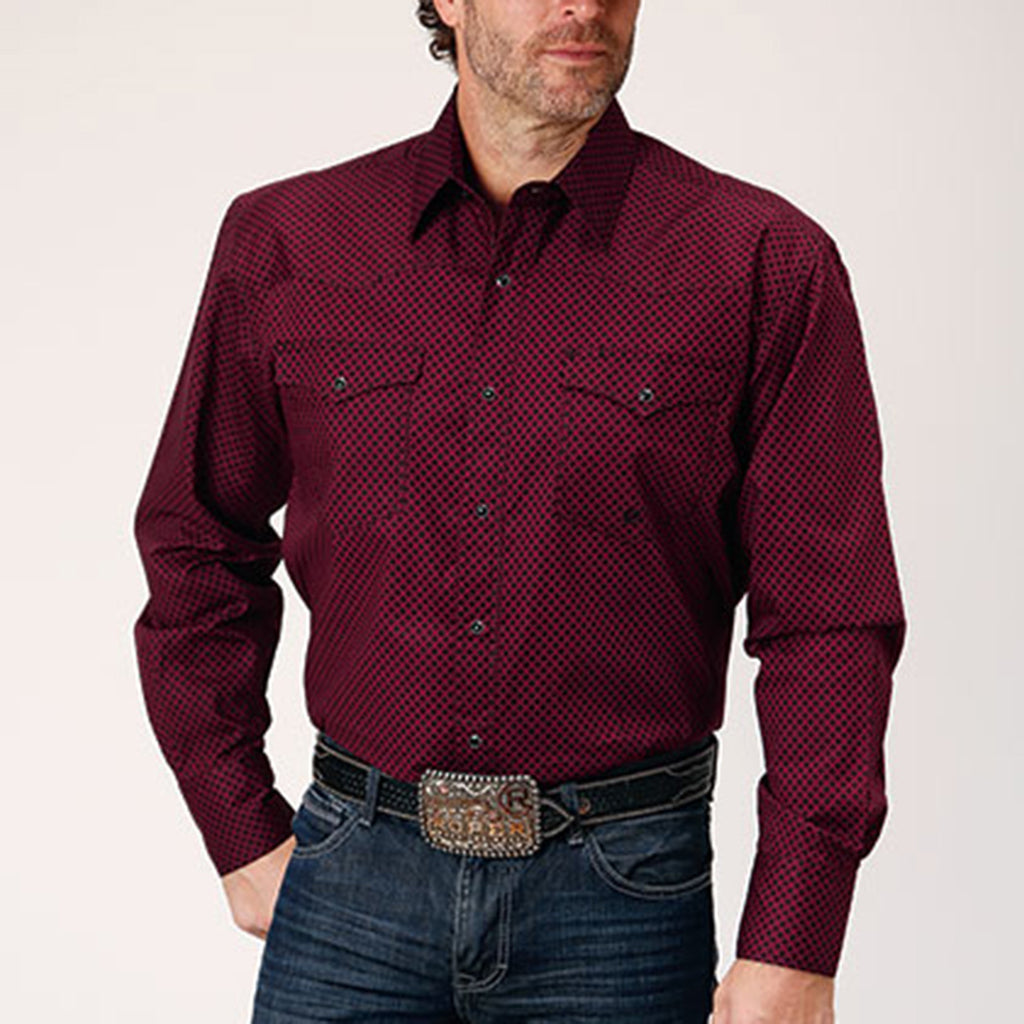 Dark red shirt with small black diamond print. Shirt is a long sleeve with two front pockets and black pearl snaps. 
