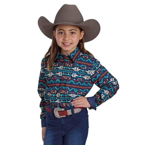 Girl wearing a navy and rust colored aztec pring long sleeve shirt