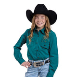 Girl wearing solid teal snap closure long sleeve shirt