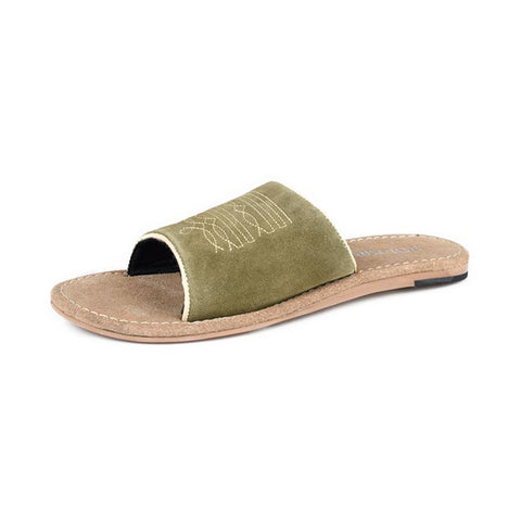 Green suede boot stitch slide sandal with Western‑inspired stitching and a soft suede texture shown from a front angle.