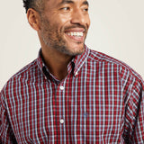 Close up view of the shirt, it features a button down collar. 