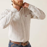 Front view of white long sleeve button down shirt with front chest pocket and blue and red details.