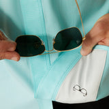 Man cleaning glasses with built in sunglass cloth on the bottom of shirt.