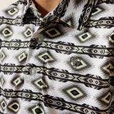 Close up view of the shirt design, it features an Ariat embroidered logo on the left chest. 