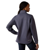 Back view of a woman wearing a dark ombre blue pullover with a quarter zip