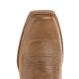 Toe of boot, it is a cutter toe with light brown leather and boot stitching. 