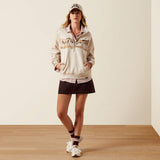 Detail view of women’s oatmeal heather Ariat top highlighting the neckline, pocket, and sleeves.