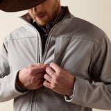 Detail view of the men’s Ariat jacket highlighting the collar, front closure, chest pocket and embossed design.