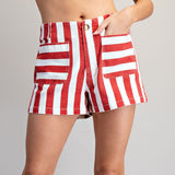 Model wearing red and white striped shorts in a front view, showing the front pockets