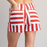 Back view of a model wearing red and white striped shorts, showing the pockets