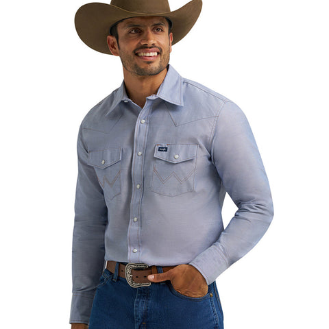 Chambray long sleeve pearl snap shirt with double chest flap snap pockets and front western yokes. 