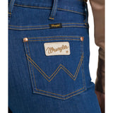 women's dark wash flare jeans with stitched W on back pocket close up view