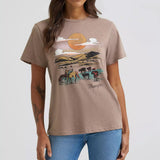  Model wearing Wrangler Women’s Desert Landscape Scene Tee, showing bold desert graphic and classic fit.