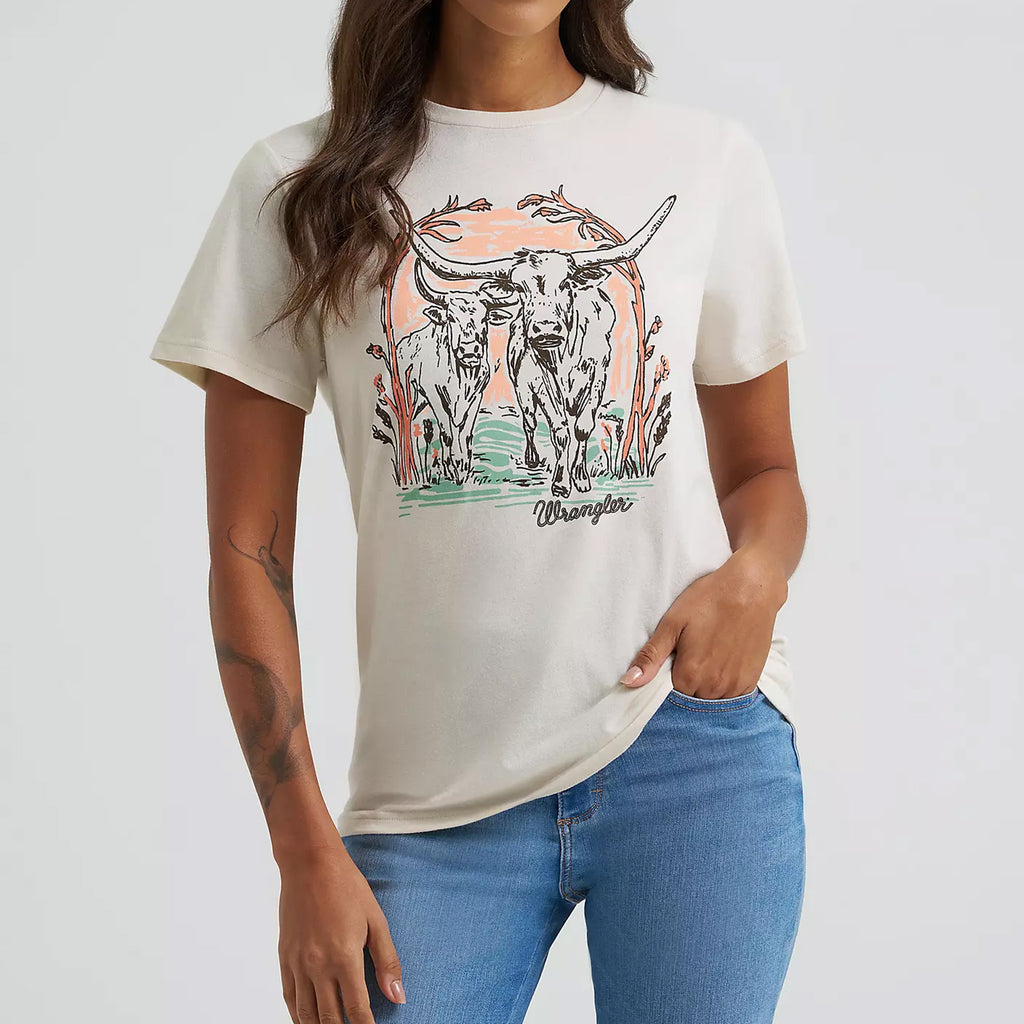 Model wearing Wrangler Women’s Cream Longhorn Tee, showing bold longhorn graphic and classic fit.