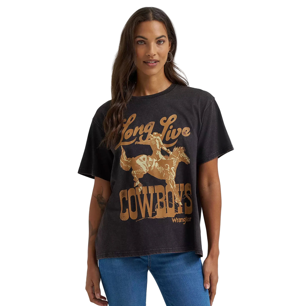 Model wearing Wrangler Women’s Black Long Live Cowboy Tee, showing bold western graphic and classic fit.