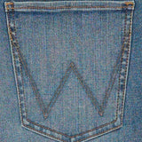 Close up view of the back pocket on the Lara Bespoke Flare jeans. 