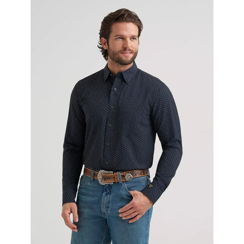 Model wearing the Wrangler Men’s Cody Johnson black spotted performance button down shirt, front view showing the button placket.