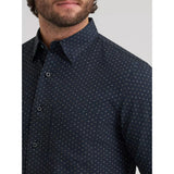 Close‑up of the Wrangler Men’s Cody Johnson black spotted performance button down shirt, showing the buttons, spotted print, and breathable stretch performance fabric.