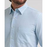 Close‑up of the men’s Cody Johnson performance button down shirt in blue and white, showing the button placket, stretch performance fabric, and subtle texture.