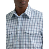 Close‑up of the men’s wrinkle resist Western snap plaid shirt in white and grey, showing the pearl snaps, plaid texture, and wrinkle‑resistant fabric.
