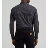 Back view of a model wearing the Wrangler Retro long sleeve Western shirt, showing the Western back yoke, clean lines, and tailored fit.