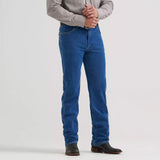 Model wearing Wrangler Cowboy Original Tough Lite stone wash jeans, front view showing the classic Western fit, lightweight denim, and straight‑leg silhouette.