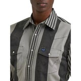 Close‑up of the Wrangler men’s black and gray Brushpopper shirt, showing the textured cotton fabric, pearl snap details, and vintage stripe design.