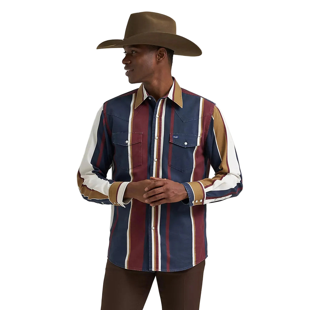 Model wearing the Wrangler men’s vintage navy multi striped long sleeve Western shirt, front view showing the bold stripe pattern, snap placket, and classic fit.