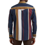 Back view of a model wearing the Wrangler vintage navy multi striped long sleeve shirt, showing the full stripe pattern, Western yoke detail, and comfortable fit.