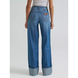 Back view of a model wearing the Wrangler Bailey high rise wide leg cuffed jean, showing the contoured fit, stitched back pockets, and smooth wide‑leg drape.