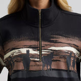 Close‑up of the Wrangler Women’s Wild West 1/4 zip pullover, showing the textured fleece fabric, zipper detail, and Western‑inspired styling.