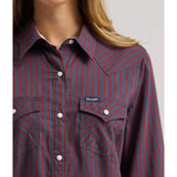 Close‑up of the Wrangler women’s burgundy retro stripe Western shirt, showing the snap closures, textured fabric, and vintage‑inspired stripe detail.