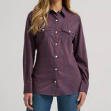 Model wearing the Wrangler women’s burgundy retro stripe long sleeve Western shirt, front view showing the snap placket, stripe pattern, and slim Western fit.