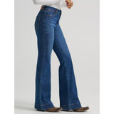 Side view of a model wearing the Women’s Wrangler BESPOKE high rise trouser jean, highlighting the tailored waist, smooth trouser leg, and refined Western silhouette.