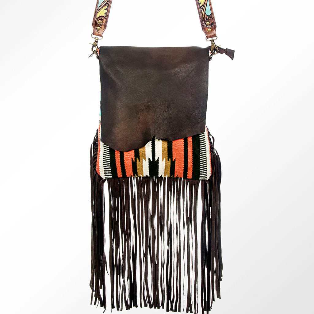Messenger style bag with colorful Aztec wool and a leather overlay and fringe on the bottom.