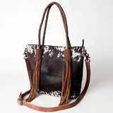 Front side view of cowhide fringe purse. 