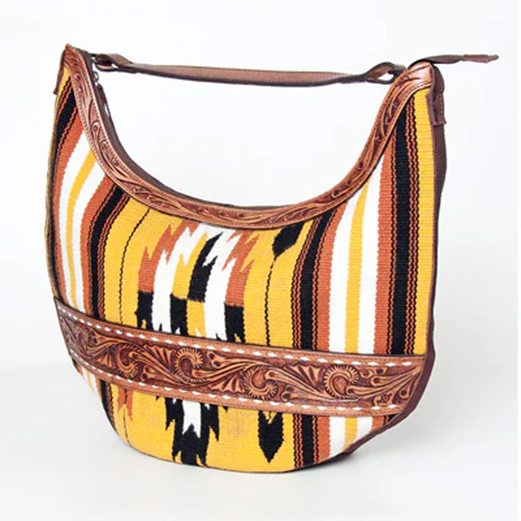 Yellow. orange, and black blanket purse with leather strap the goes across the middle. 