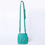 Tooled turquoise purse with matching buckle strap.