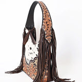 side view of purse - showing sunflower tooled strap and brown fringe