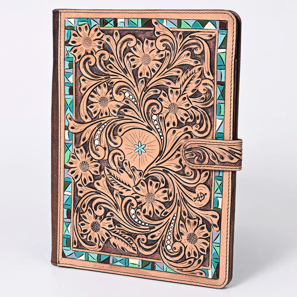Tooled Floral print with Turquoise accent edging. Snap closer
