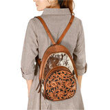 Backpack styled view of cowhide and tooled purse
