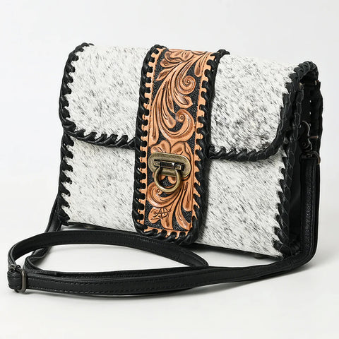 Front side view of leather and cowhide purse. 