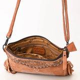 Inside view of brown suede crossbody purse featuring a zip compartment