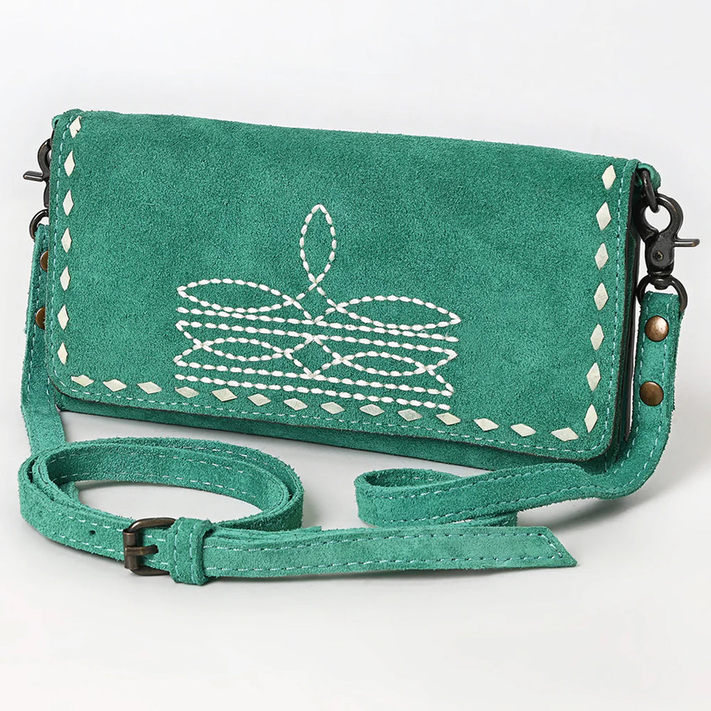 Front side view of turquoise suede bag. 