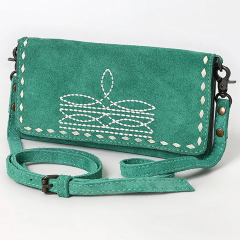 Front side view of turquoise suede bag. 