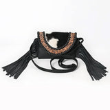 Black fringe purse with a tooled U-flap and black & white cowhide.