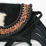 Close up of tooling and hide with unique stitching