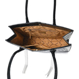 Open view of the inside of the bag, Has a pocket on each inside wall, one with a zipper and one without. 