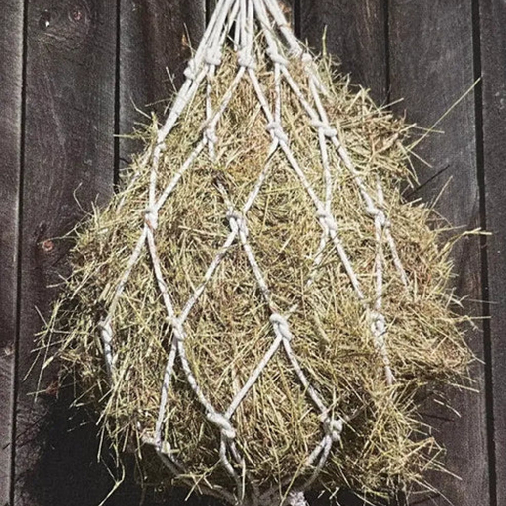 Hanging view of hay bag with hay filled in the bag 